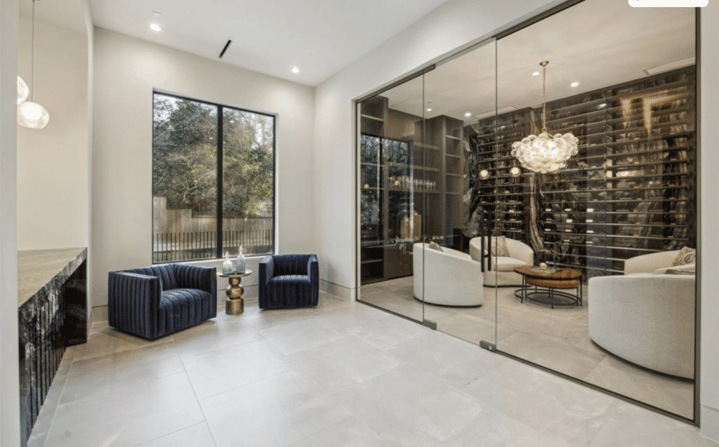 The glass-enclosed wine room at 11264 Memorial Drive